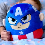 A little boy snuggling in bed cuddling the Captain America Plush Toy 