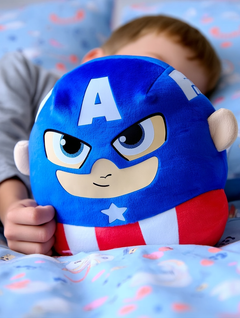 A little boy snuggling in bed cuddling the Captain America Plush Toy 