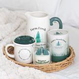 Set of mugs and a candle with 'Farm Fresh' and 'Winter Wonderland' text on a textured surface.