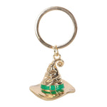 Gold and green Sorting Hat keychain on a white background