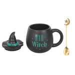 Black mug with 'Bad Witch' text, witch hat, and gold spoon on a white background