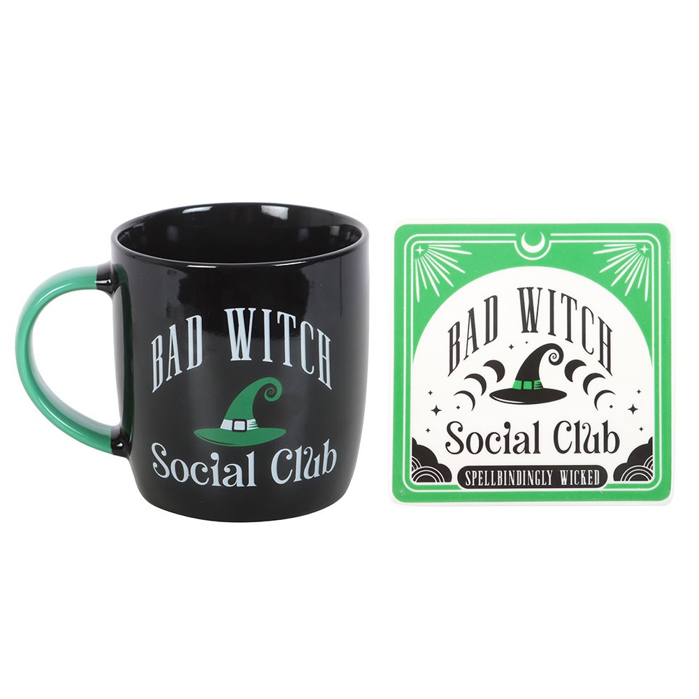 Black mug with 'Bad Witch Social Club' text and green handle, paired with a matching coaster on a white background.