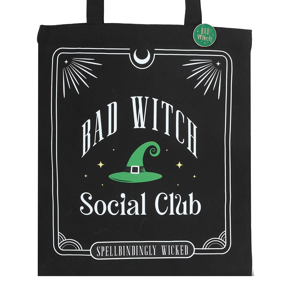 Black tote bag with 'Bad Witch Social Club' design featuring a green witch hat.
