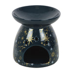 Black ceramic oil burner with star and moon designs on a white background
