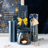 Decorative candles and diffuser with star designs on a dark background with 'Silent Night' text.