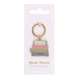 Book-themed keychain on a white card with 'Book Worm Enamel Keyring' text.