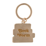 Gold keychain with 'Book Worm' text on a white background