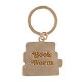 Gold keychain with 'Book Worm' text on a white background