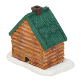 Small log cabin model with green roof on a white background