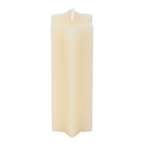 Beige candle on a white background