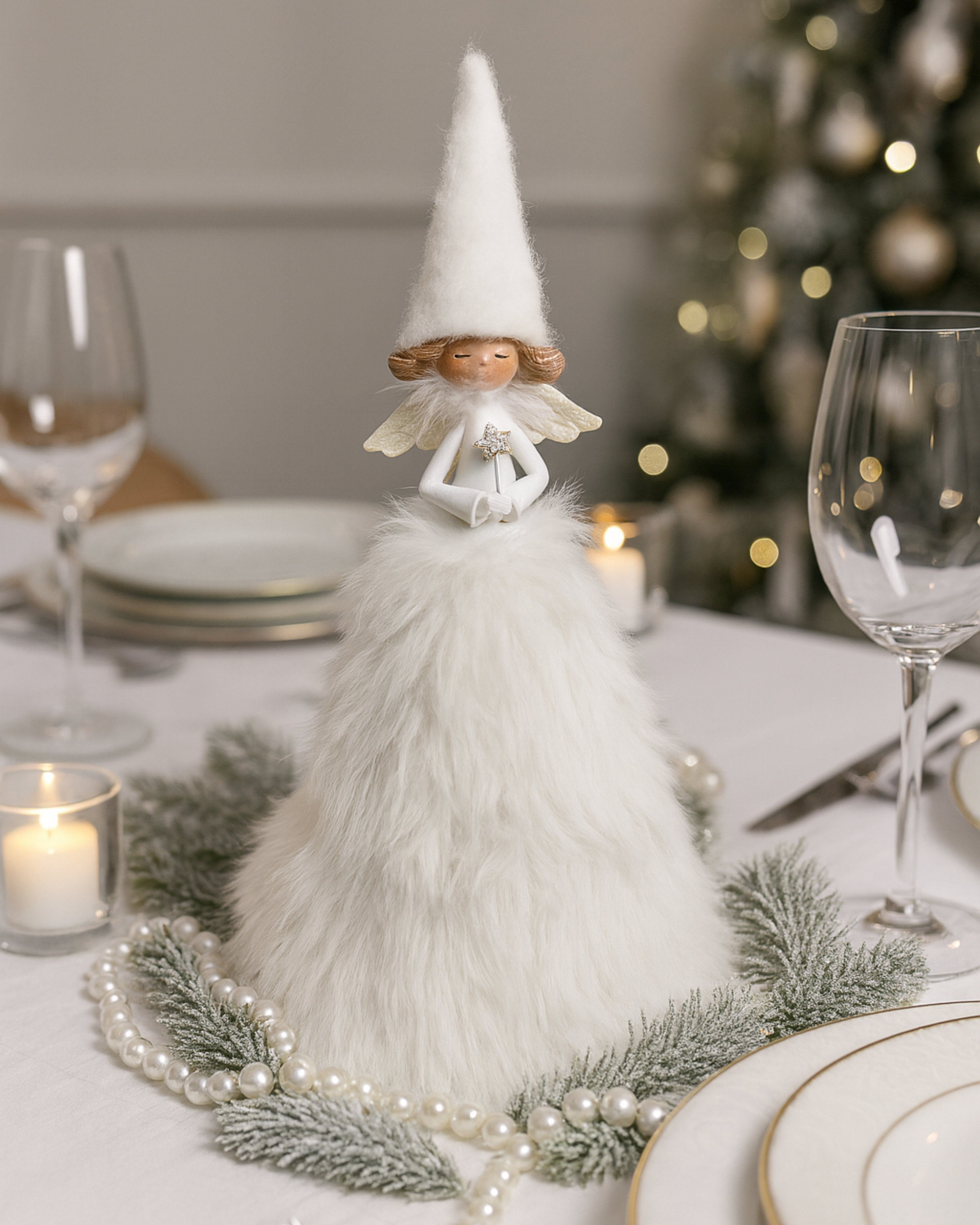 Decorative tall fluffy Angel figure on a table with Christmas decorations