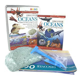 A educational tin set labeled 'Discover Oceans' with images of marine life and a book cover depicting various sea creatures.