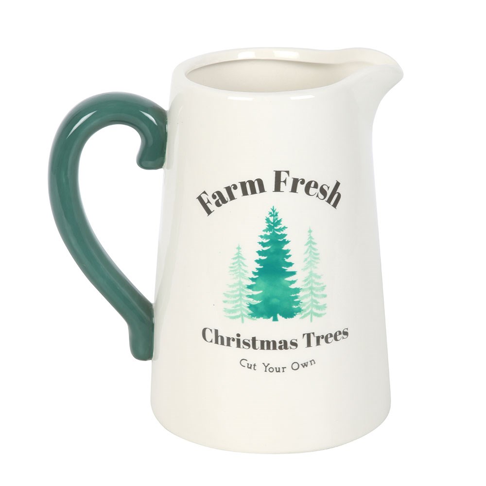 White pitcher with green handle featuring 'Farm Fresh Christmas Trees' text and tree illustrations on a white background.