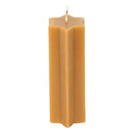 Hexagonal beeswax candle on a white background