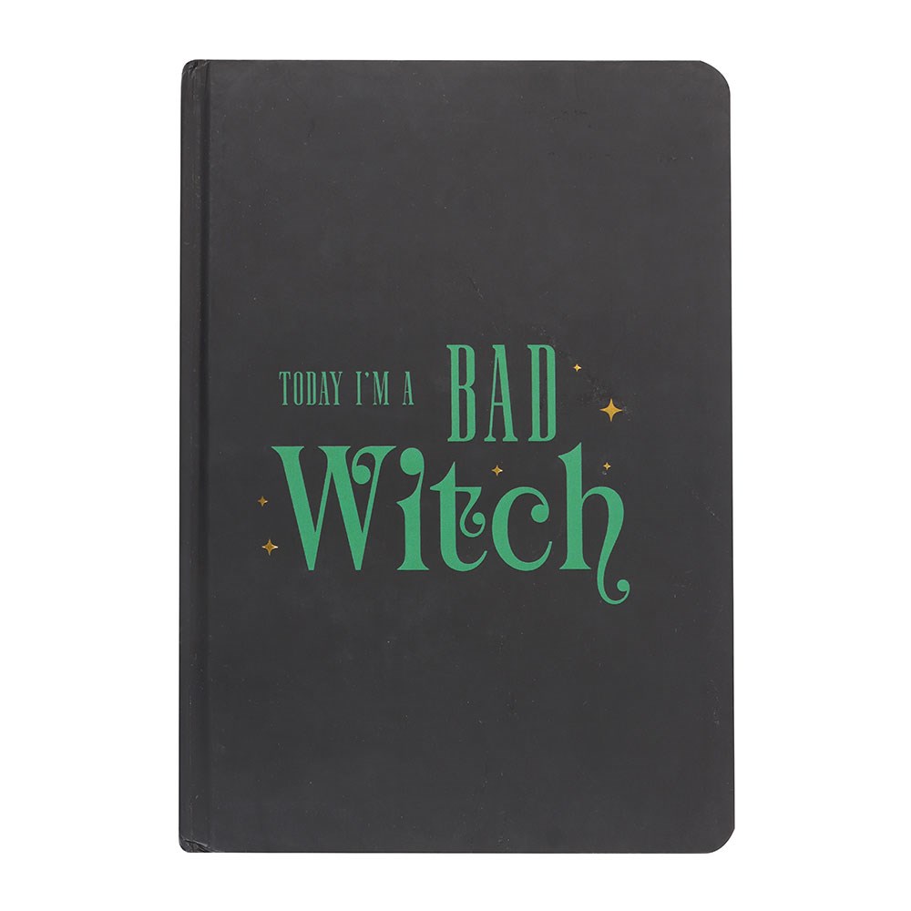 Black notebook with green text 'Today I'm a Bad Witch' on a white background
