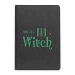 Black notebook with green text 'Today I'm a Bad Witch' on a white background