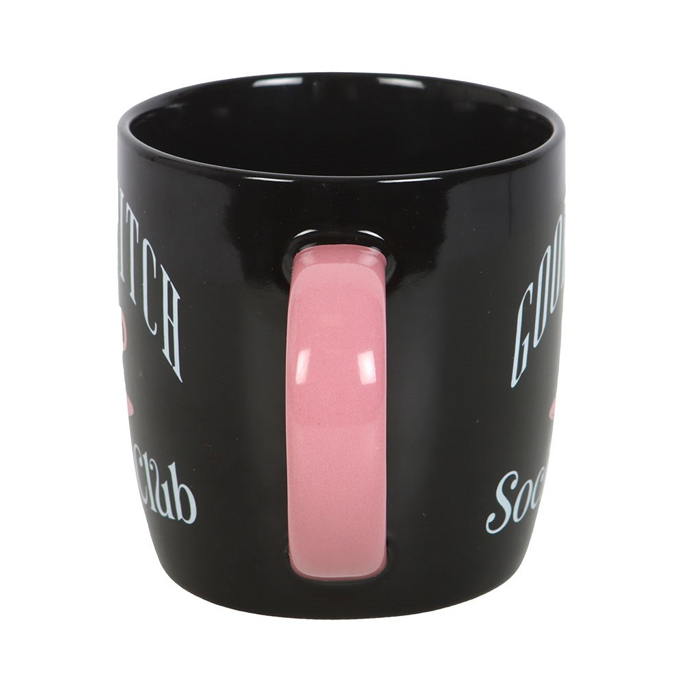 Black mug with pink handle on a white background