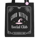 Black tote bag with 'Good Witch Social Club' text and pink witch hat design on a white background