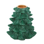 Green ceramic tree-shaped candle holder on a white background