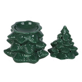 Two green ceramic tree-shaped candle holders on a white background