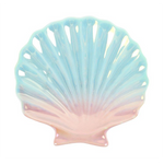 Pastel-colored shell-shaped dish on a white background
