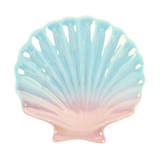 Pastel-colored shell-shaped dish on a white background