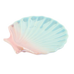 Shell-shaped dish with pastel gradient design on a white background
