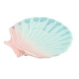 Shell-shaped dish with pastel gradient design on a white background