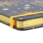 A notebook from the Starry Night Collection with text ' Leave a little sparkle wherever you go' 