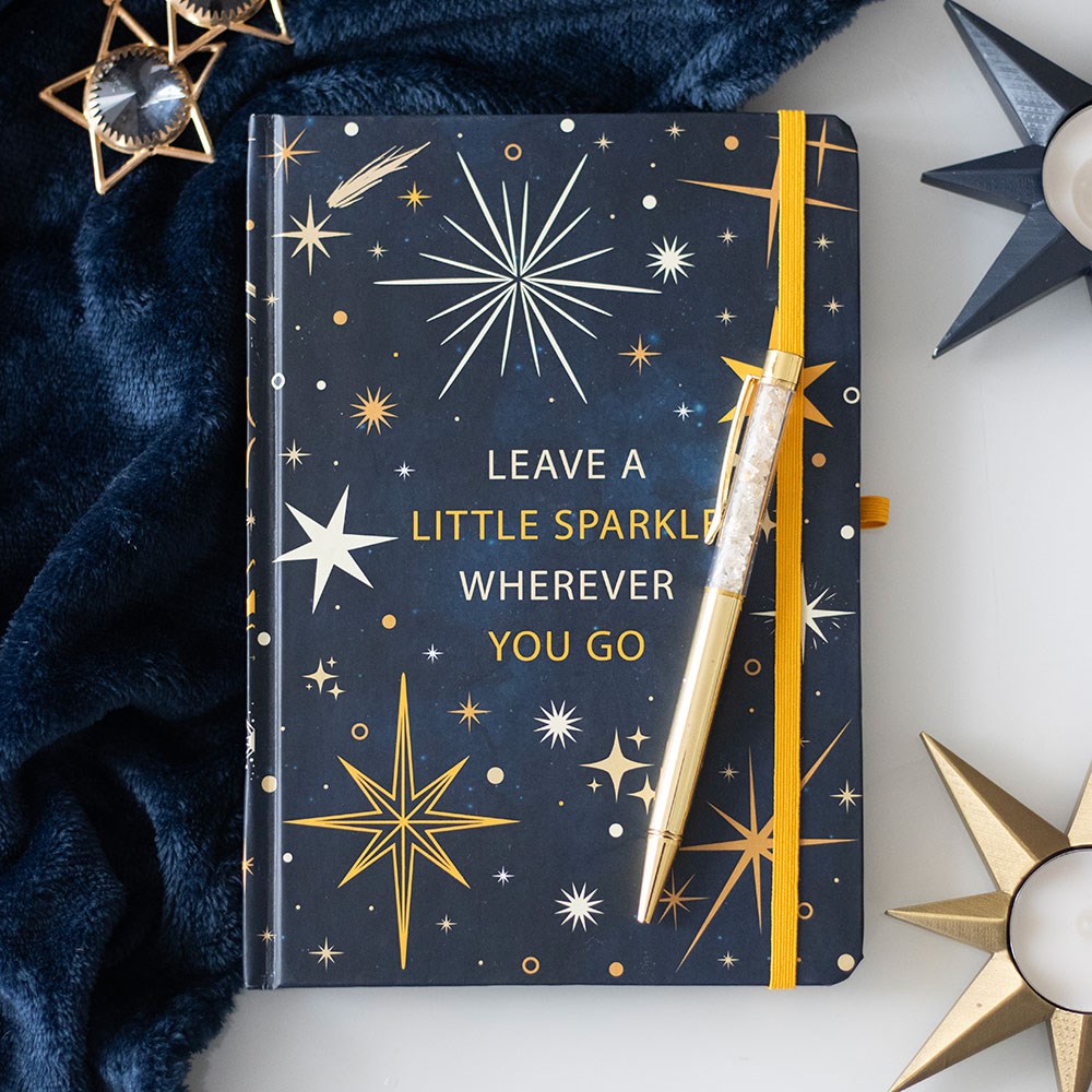 A notebook from the Starry Night Collection with text ' Leave a little sparkle wherever you go' 