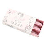 A box labeled 'Magic Love Spell in a Box' with illustrations of a heart and a spellbook. The box contains three pink spell candles.