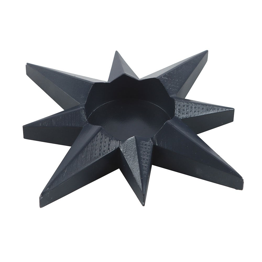 Black geometric star-shaped object on a white background