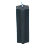 Black candle with a blue wick on a white background