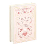 Book titled 'Let Love Grow' with decorative cover on a white background