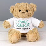 A beige teddy bear with a white jumper that says 'best daddy' with a personalised message 'From Sophie x'.