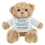 A beige teddy bear with a white jumper that says 'best daddy' with a personalised message 'From Sophie x'.