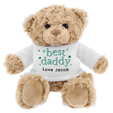 A beige teddy bear with a white jumper that says 'best daddy' with a personalised message 'From Sophie x'.