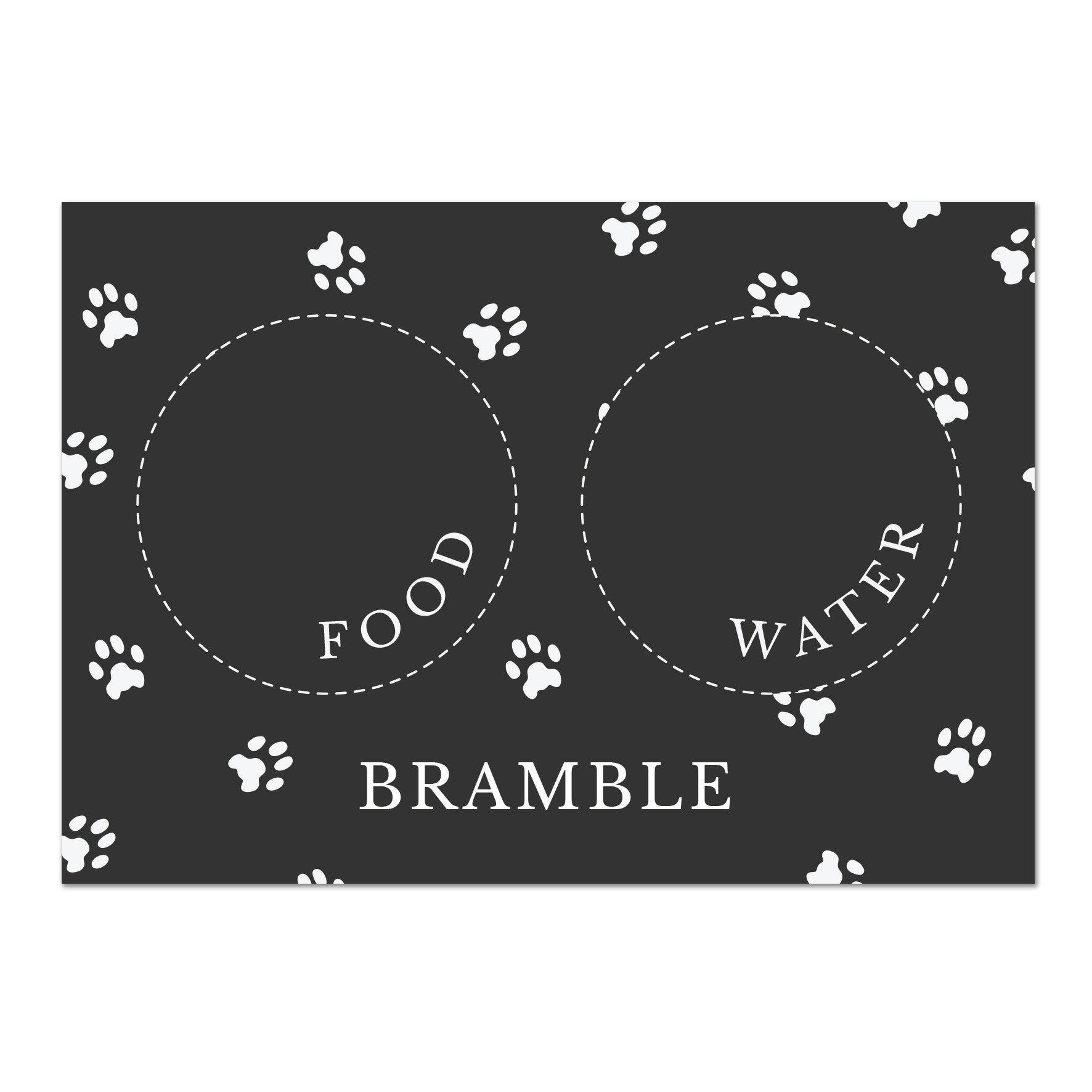 Black personalised pet bowl mat, with a bowl full of dog treats to the side 