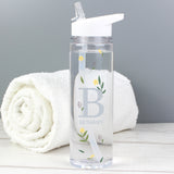A clear plastic water bottle with a white twist-on lid and a personalised floral design with the initial 'B' and the name 'Bethany'.
