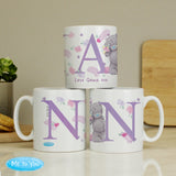 Three ceramic mugs with 'Nan' written on each, featuring floral and animal designs, placed on a table with a 'Me To You' logo in the corner.