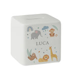A white ceramic square money box with a personalised name 'Arthur' and a jungle animal theme, featuring illustrations of an elephant, giraffe, monkey, lion, and zebra.