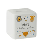 A white ceramic square money box with a personalised inscription and decorated with safari animal illustrations, including a lion and a giraffe, and the name 'Noah'.