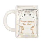White mug with 'Read Books Be Kind' text and palm tree design on a white background