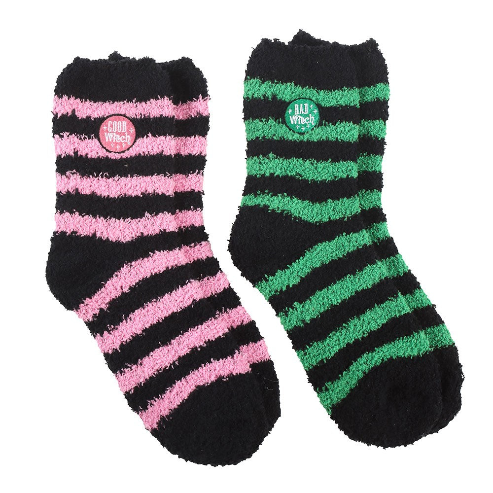 Two pairs of striped socks, one pink and black, the other green and black, on a white background.