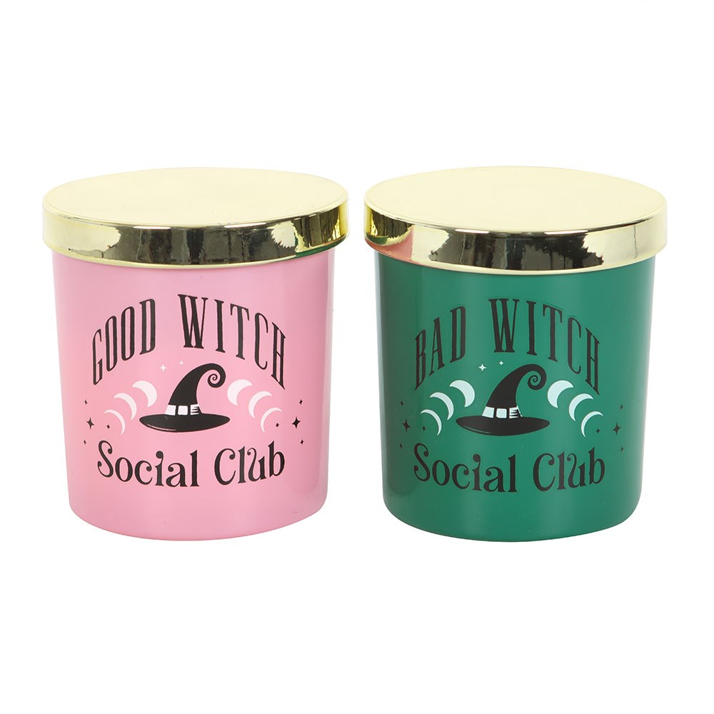 Two candles with gold lids, one pink and one green, featuring 'Good Witch Social Club' and 'Bad Witch Social Club' text.