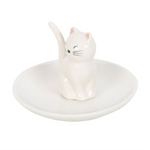 White ceramic ring holder with a cat design on a white background