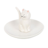 White ceramic ring holder with a cat design on a white background