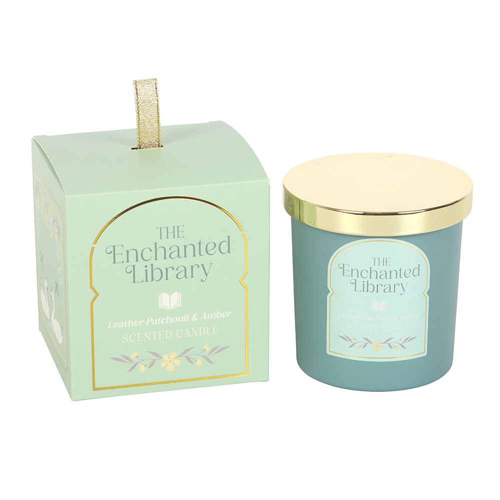 Candle with gold lid and packaging labeled 'The Enchanted Library' on a white background