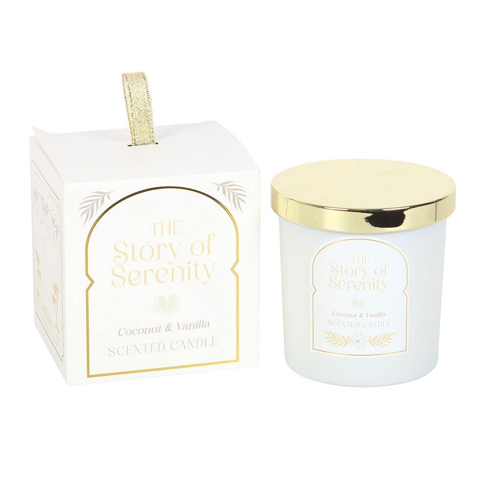 Scented candle with gold lid and packaging labeled 'The Story of Serenity' on a white background