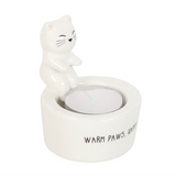 Cat-shaped candle holder with a small candle inside on a white background
